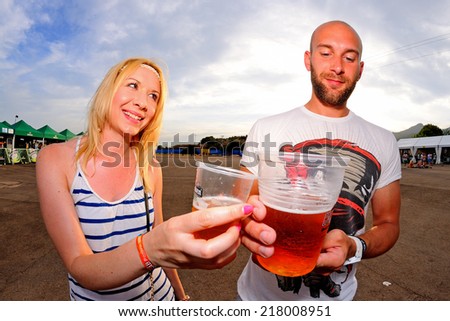 BENICASSIM, SPAIN - JULY 17: People have fun, drink beer and watch concerts at FIB Festival on July 17, 2014 in Benicassim, Spain.