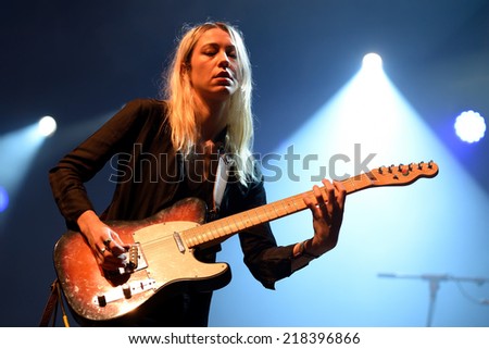 BENICASSIM, SPAIN - JULY 19: Woman guitarist of Cat Power (band) performance at FIB Festival on July 19, 2014 in Benicassim, Spain.