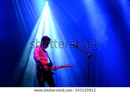 BILBAO, SPAIN - OCT 31: Silhouette of the guitar player of We Cut Corners (band) live performance at Bime Festival on October 31, 2014 in Bilbao, Spain.