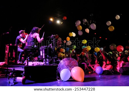 BARCELONA - APR 2: Matt and Kim, energetic indie pop couple surrounded by colorful balloons launched by the audience, performs at Apolo on April 2, 2011 in Barcelona, Spain.