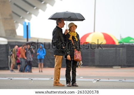 BARCELONA - MAY 28: People with umbrellas, under the rain at Heineken Primavera Sound 2014 Festival (PS14) on May 28, 2014 in Barcelona, Spain.