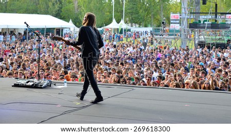 MADRID - SEP 13: A picture from the backstage of the guitar player of Band of Skulls (rock band) in front of the crowd, in their concert at Dcode Festival on September 13, 2014 in Madrid, Spain.