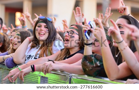BARCELONA - MAY 23: Girls from the audience in front of the stage, cheering on their idols at the Primavera Pop Festival of Badalona on May 18, 2014 in Barcelona, Spain.