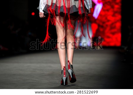 BARCELONA - FEB 2: The legs of a model walks the runway for the Brain and Beast collection at the 080 Barcelona Fashion Week 2015 Fall Winter on February 2, 2015 in Barcelona, Spain.