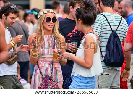 BARCELONA - JUN 12: Blonde woman from the audience at Sonar Festival on June 12, 2014 in Barcelona, Spain.