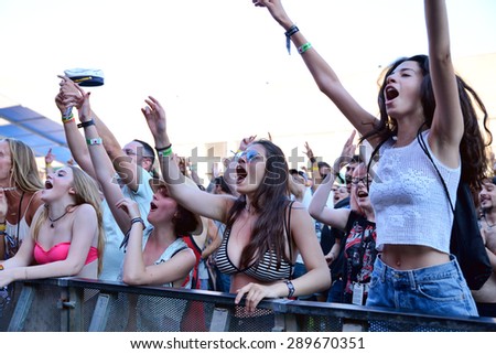 BARCELONA - JUN 20: People from the audience dance at Sonar Festival on June 20, 2015 in Barcelona, Spain.