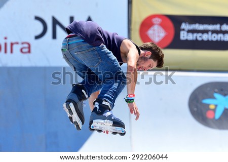 BARCELONA - JUN 28: A professional skater at the inline skating jumps competition at LKXA Extreme Sports Barcelona Games on June 28, 2014 in Barcelona, Spain.