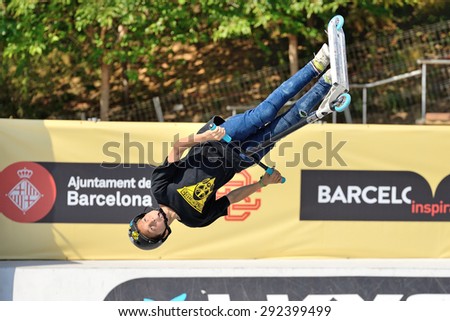 BARCELONA - JUN 28: A professional rider at the Scooter Pak competition on the Central Park at LKXA Extreme Sports Barcelona Games on June 28, 2014 in Barcelona, Spain.