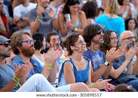 BARCELONA - JUL 3: People from the audience applauding at Vida Festival on July 3, 2015 in Barcelona, Spain.