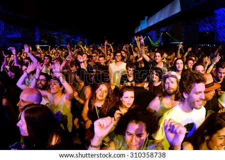 BARCELONA - JUN 19: Crowd dance in a concert at Sonar Festival on June 19, 2015 in Barcelona, Spain.