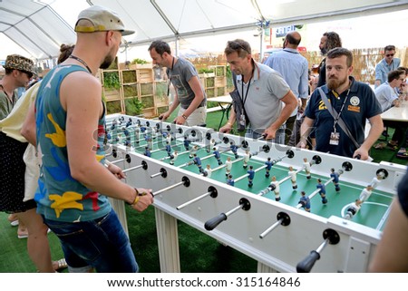 BARCELONA - JUN 19: People play in an extra large foosball (also know as table soccer and table football)  at Sonar Festival on June 19, 2015 in Barcelona, Spain.