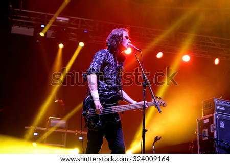 BENICASSIM, SPAIN - JUL 17: The bass player of Palma Violets (garage rock band) performs at FIB Festival on July 17, 2015 in Benicassim, Spain.