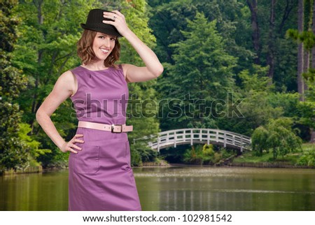 Beautiful young woman in a sleeveless mod dress