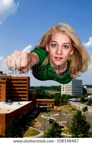 Beautiful woman super hero flying through the sky