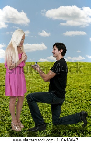 Man with a wedding ring proposing marriage to a woman