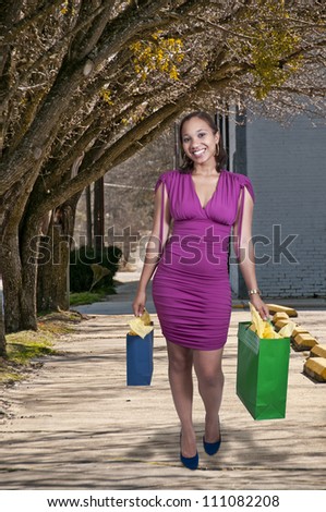 Young beautiful black African American woman on a shopping spree