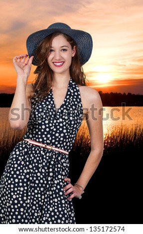 Beautiful young sexy woman wearing a floppy hat