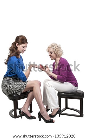 Beautiful young woman getting her nails done