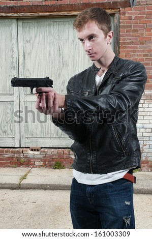 Police detective man on the job with a gun