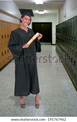 Young hispanic latino woman in her graduation robes