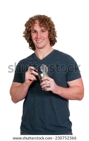 Man eating food out of a tin can