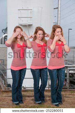 Woman doing the tradition see no evil hear no evil speak no evil gesture