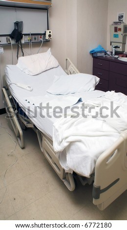 A medical patient's bed in a hospital.