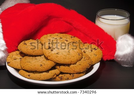A plate of cookies and a glass of milk left out for Santa Claus
