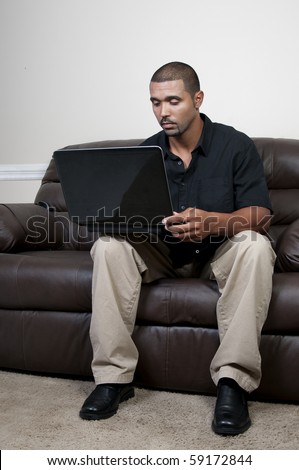 A middle aged man using a computer