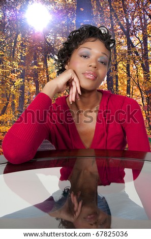 A very beautiful African American woman with a big smile thinking