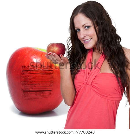 A whole red delicious apple with a nutrition label