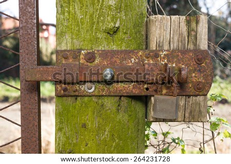 Close-up shot of an old rusty latch and lock