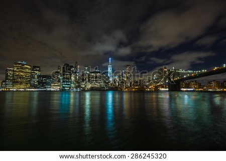 New York by night: Lower Manhattan and the Brooklyn Bridge as seen from Brooklyn side, in the center of the picture the One World Trade Center (Freedom Tower)