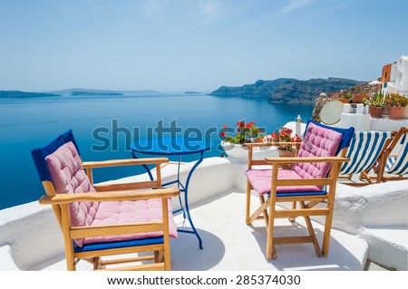 Beautiful terrace with sea view. White architecture on Santorini island, Greece.