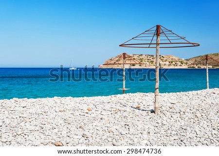 Beautiful beach with turquoise water and white pebbles. Plaka village, East coast of Crete island, Greece.