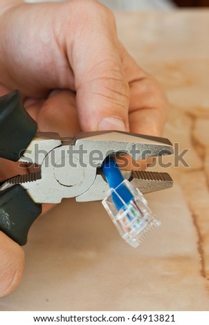 Blue Ethernet cable being cut, symbolizing the need to connect on a face to face level