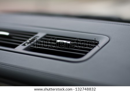 Car ventilation system. Air conditioning holes in automobile interior. Luxury car