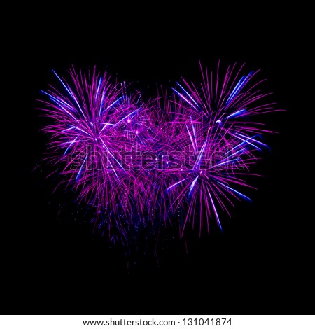 Colorful heart fireworks on the black sky background