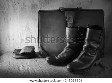 Still life art on casual concept with boots wallet purse case black and white version