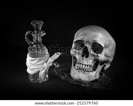 Still life art on skull with crystal glassware light painting technique black and white version