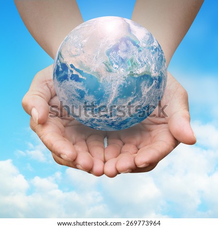Human hands palm up with NASA global image as design element over white