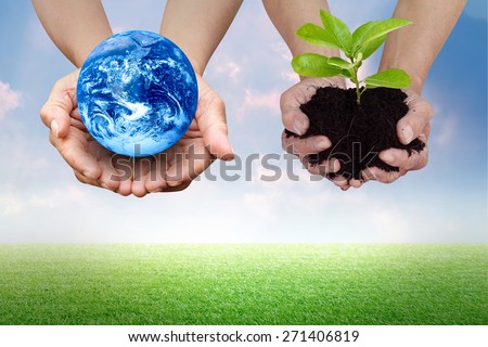 Earth conserve concept with hands carrying global and green tree over nature background Elements of this image furnished by NASA