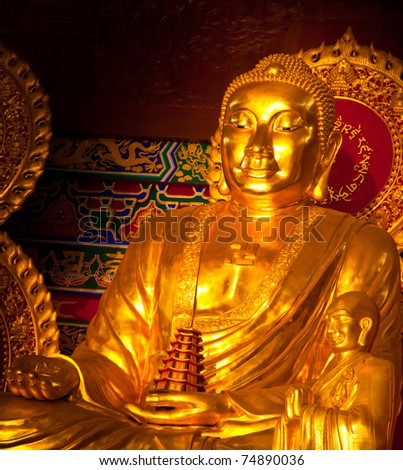 Golden Buddha in Chinese art style at Chinese temple in Thailand.