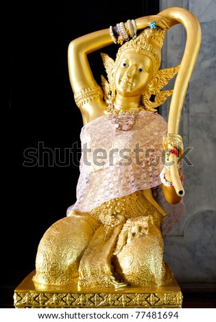 Holy Mother Earth of Thai myth is a woman giving water from her bun.