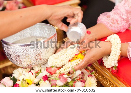 THAILAND - APRIL 11: Thai people celebrate Songkran (new year / water festival: 13 April) by giving garlands to their seniors and asked for blessings on April 11, 2012 in Nakhonratchasima, Thailand.