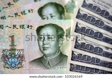 One Chinese Yuan Bills isolated on American money.  Concept photo of money, banking ,currency and foreign exchange rates.