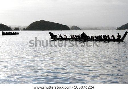 A traditional New Zealand Maori waka boat on the sea in the Bay of islands, New Zealand.