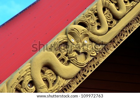 Traditional Maori wood carvings in a Marae (meeting house) in New Zealand.