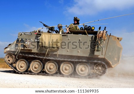 NACHAL OZ - JUNE 07:A moving heavily armored personnel carrier (M-113) on June 07 2009  in Nachakl Oz ,Israel.It\'s US Made since 1960 and it\'s the most common armored personnel carrier in the world.