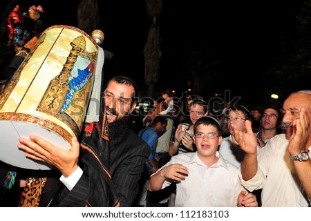 SDEROT - OCTOBER 14:Jewish people celebrate Simchat Torah on Oct 14 2006 in Sderot, Israel. Simchat Torah is a celebratory Jewish holiday marks the completion of the annual Torah reading cycle.